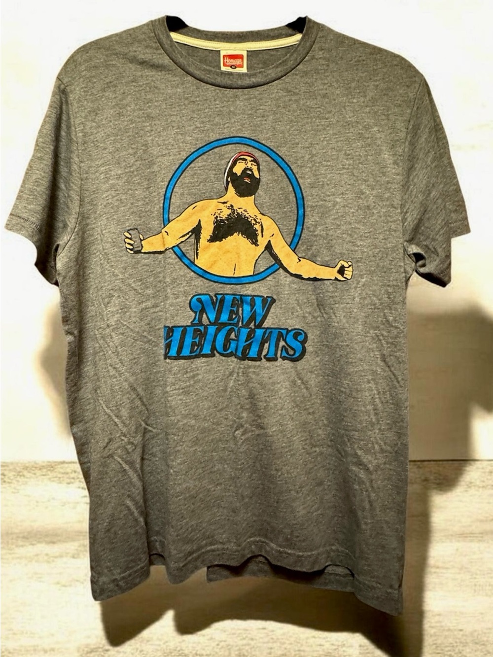 HOMAGE Gray Tee with Blue & Yellow "New Heights" Graphic